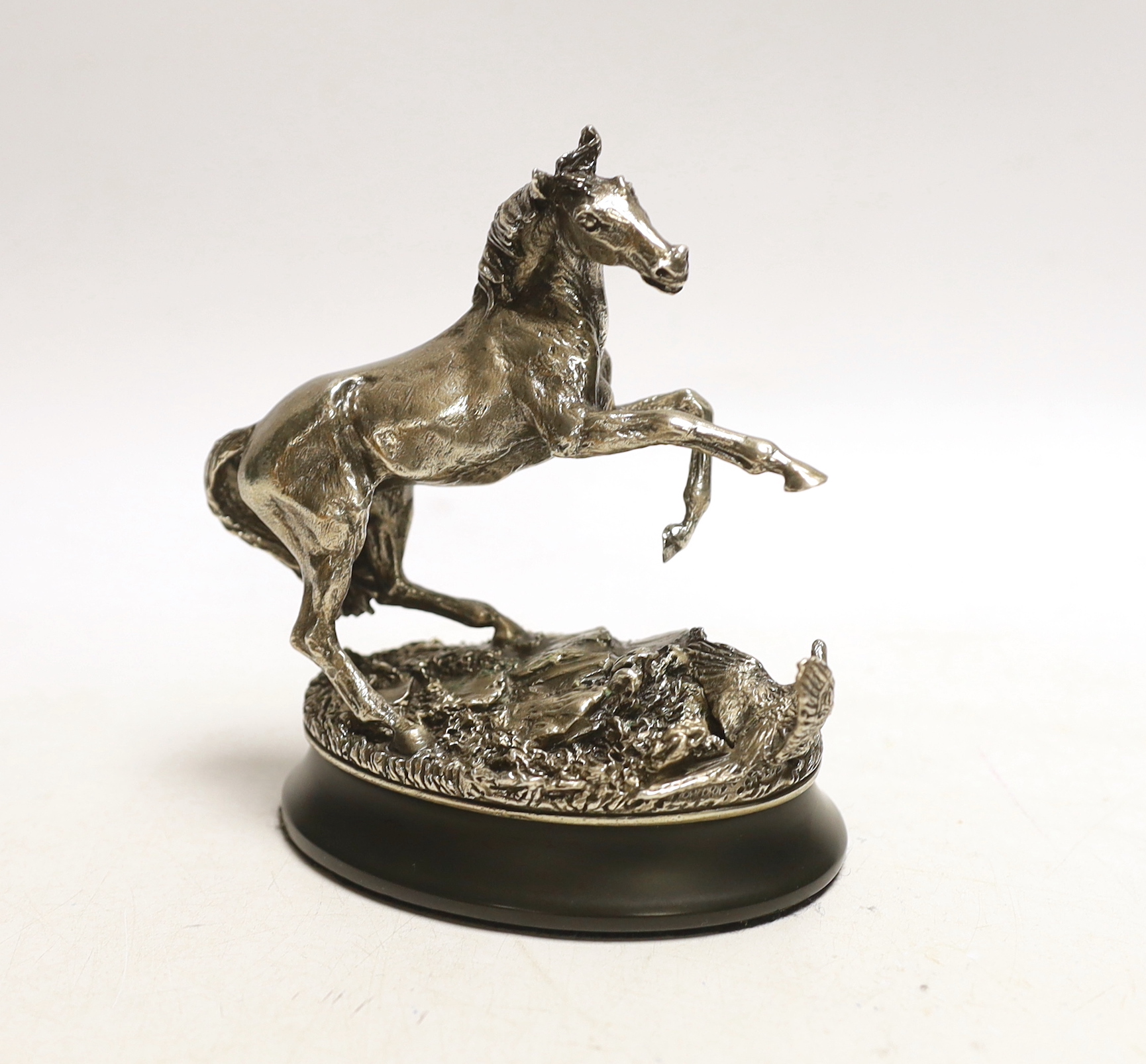 After Geoffrey Snell, a modern sterling 'The 1977 British Horse Society' model of a horse 'Startled Yearling', on weighted oval base, with certificate of authenticity, overall height 11.5cm.